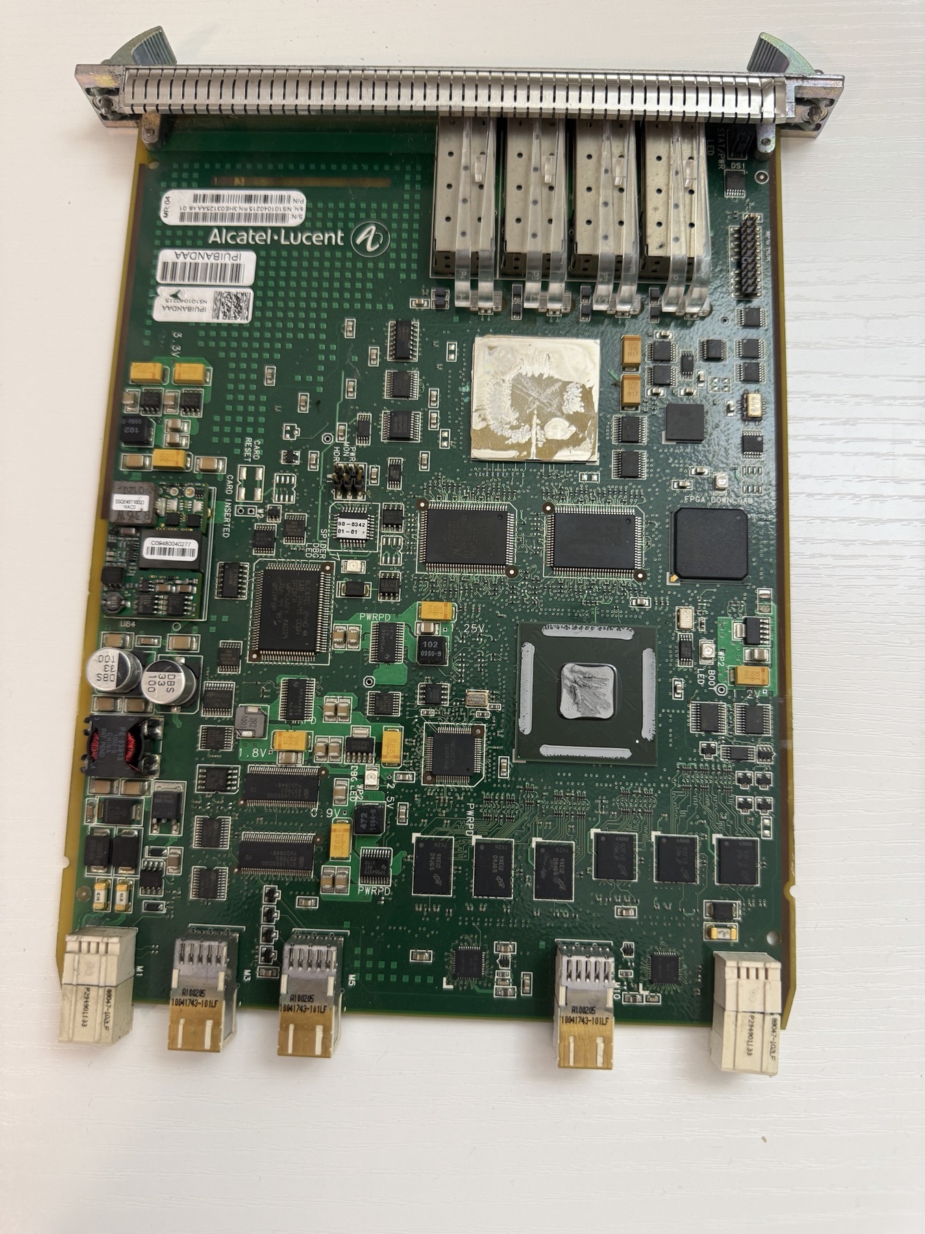 A real scrap circuit board being scanned, with the chips worth recovering outlined as the scan passes over them.